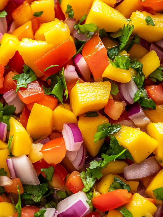 A close up of a pile of sliced mangoes.