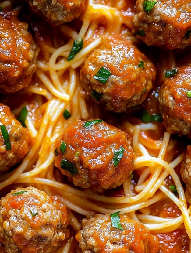 A plate of creamy spaghetti meatballs.