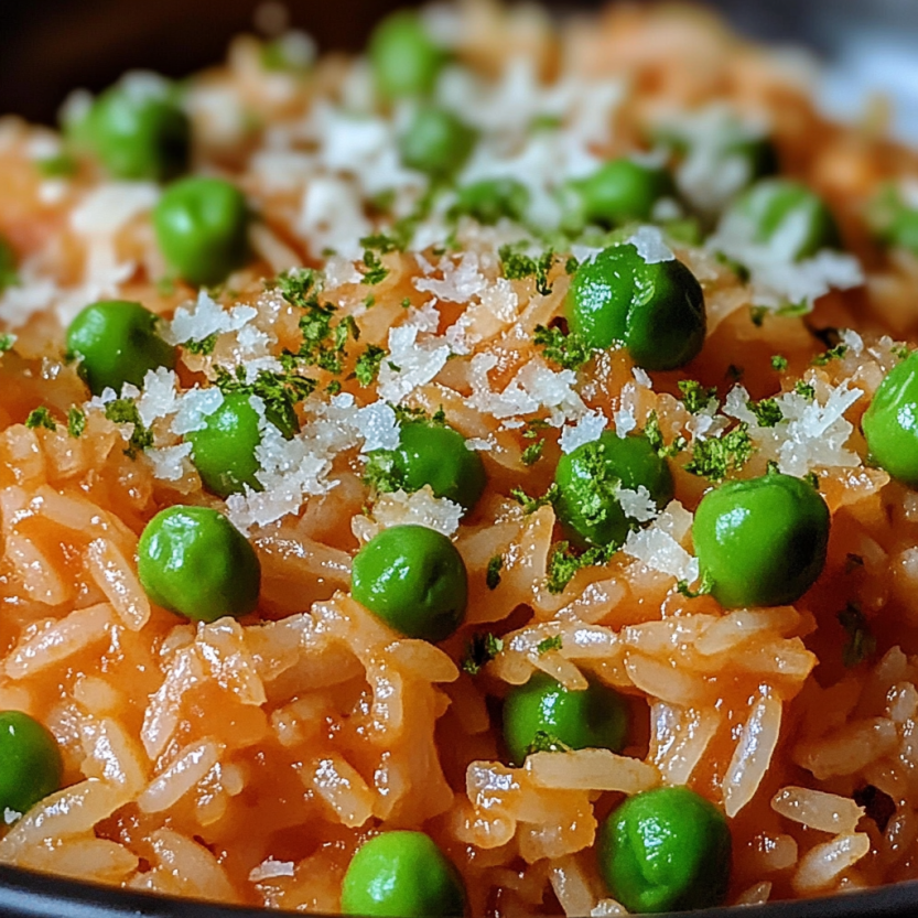 A bowl of rice with peas and cheese.