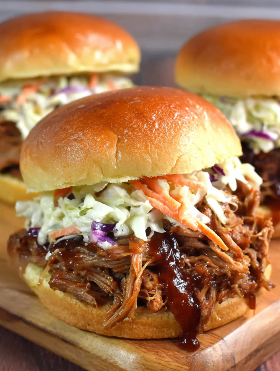 A close up of a pulled pork sandwich with coleslaw.