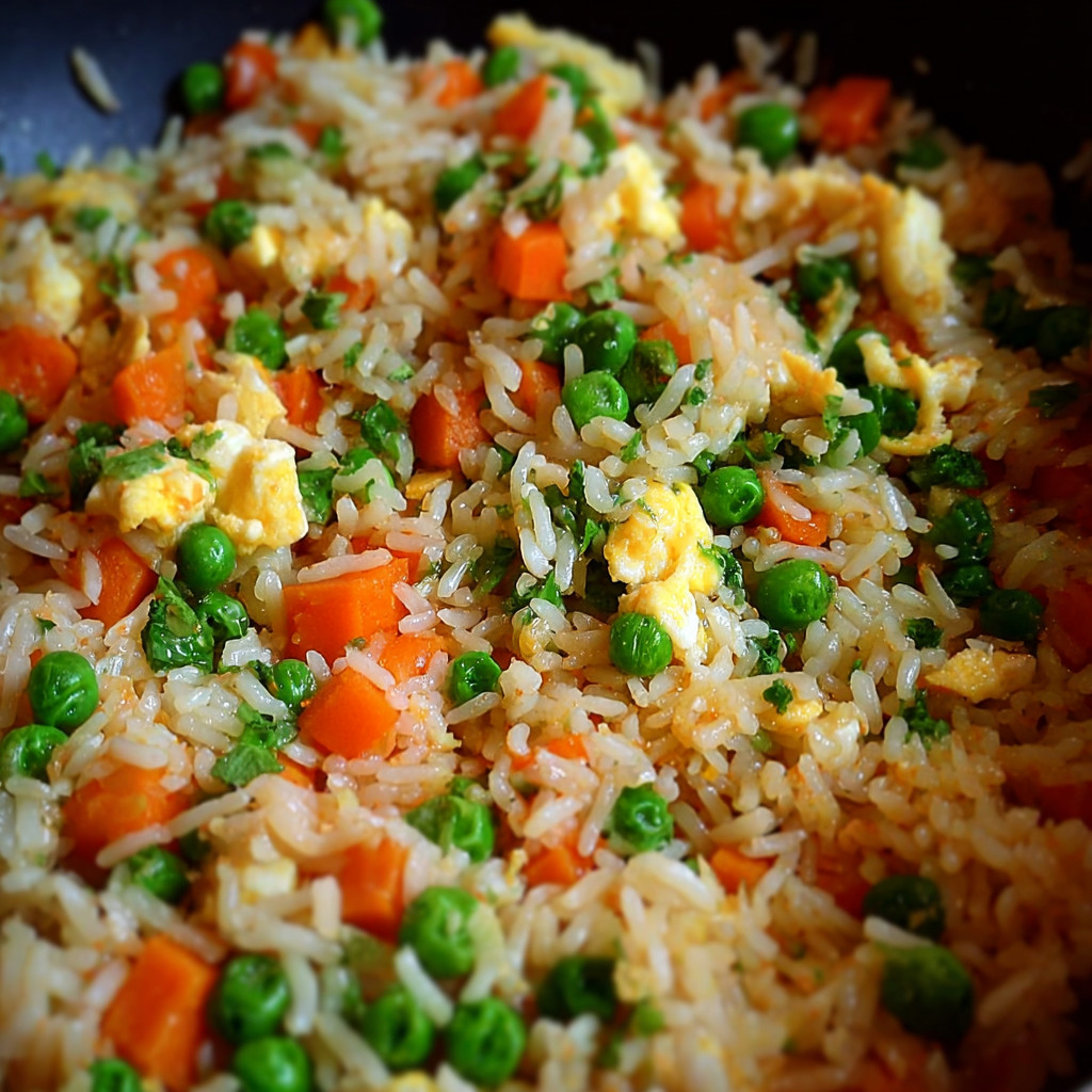 A plate of egg fried rice.