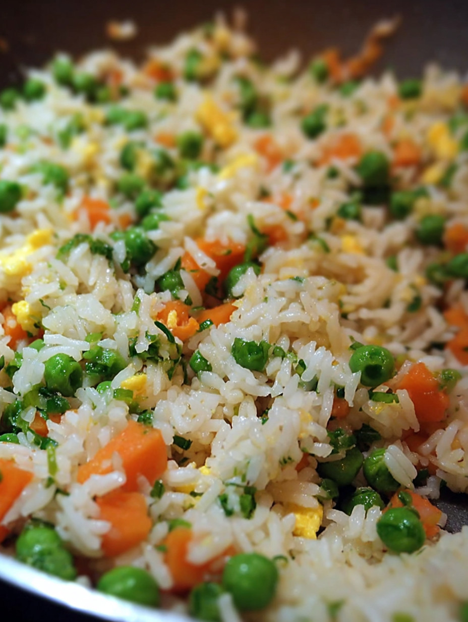 A close up of a dish of egg fried rice.