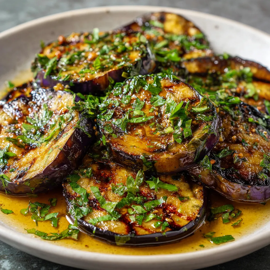 Grilled eggplant with green herbs.