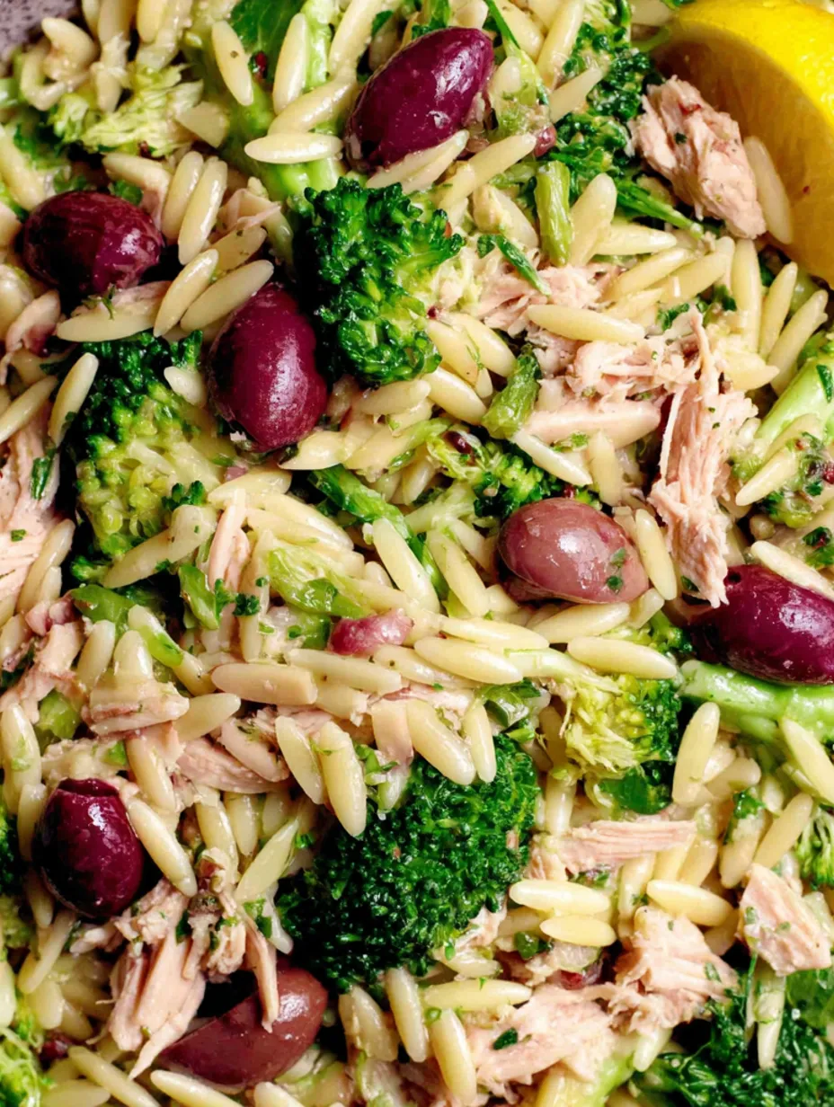 A close up of a dish with broccoli, olives, and rice.