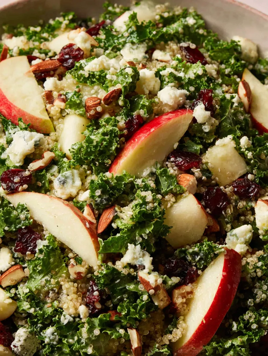 A salad made of kale, quinoa, and apples.