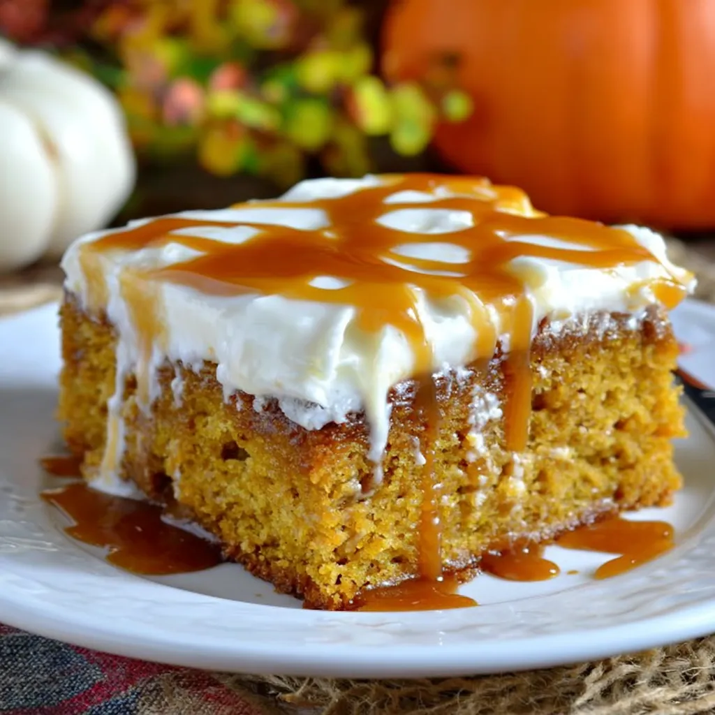 A slice of caramel pumpkin cake on a plate.
