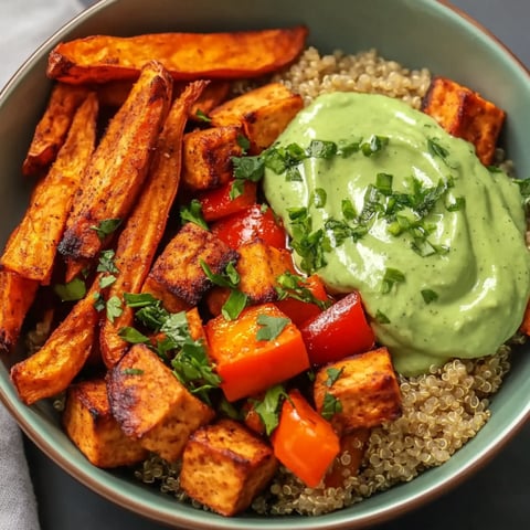 A bowl of food with tofu and vegetables.
