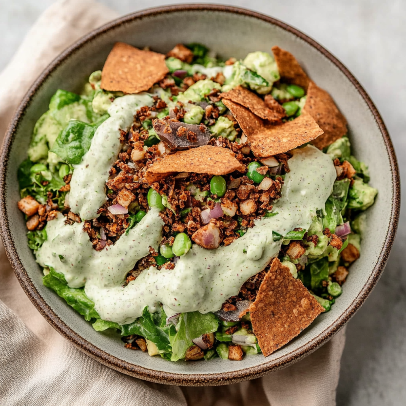 A bowl of crispy lentil salad with cilantro chive dressing.