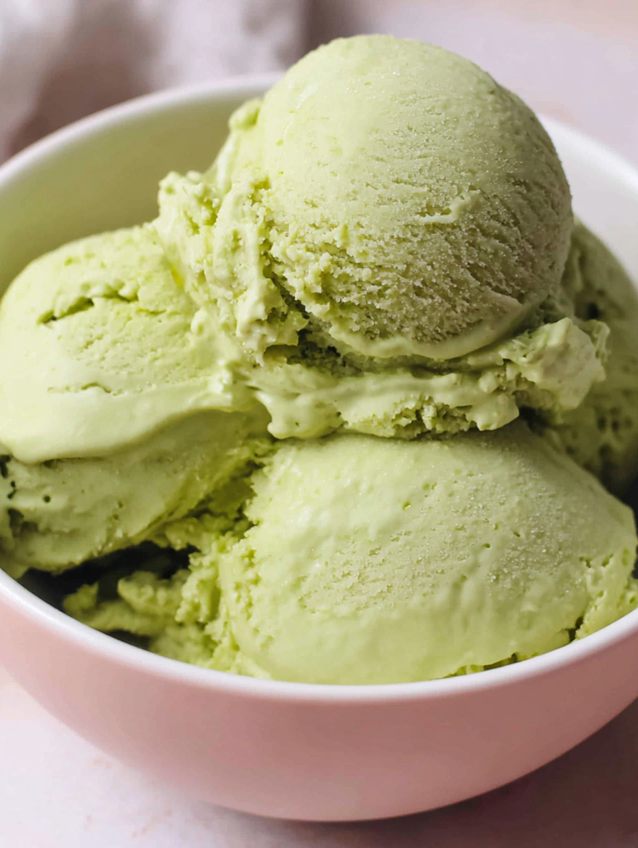 A bowl of green ice cream.