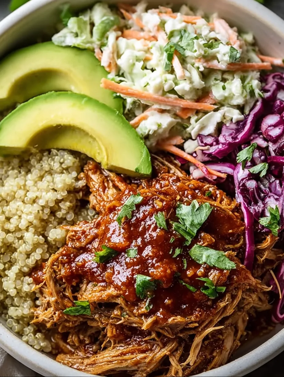 A bowl of food with meat, vegetables and sauce.