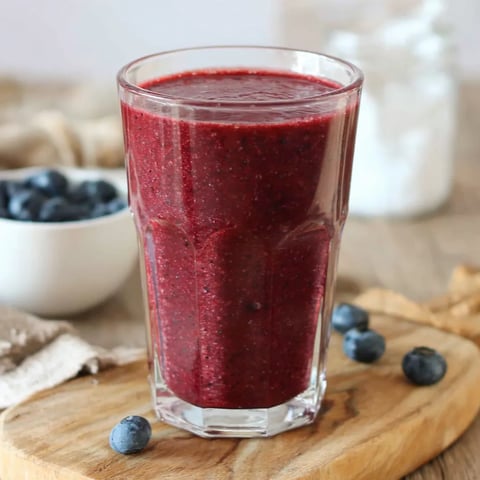 A glass of cranberry blueberry juice.