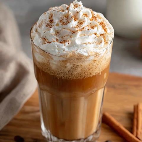 A glass of iced pumpkin cream chai tea latte.